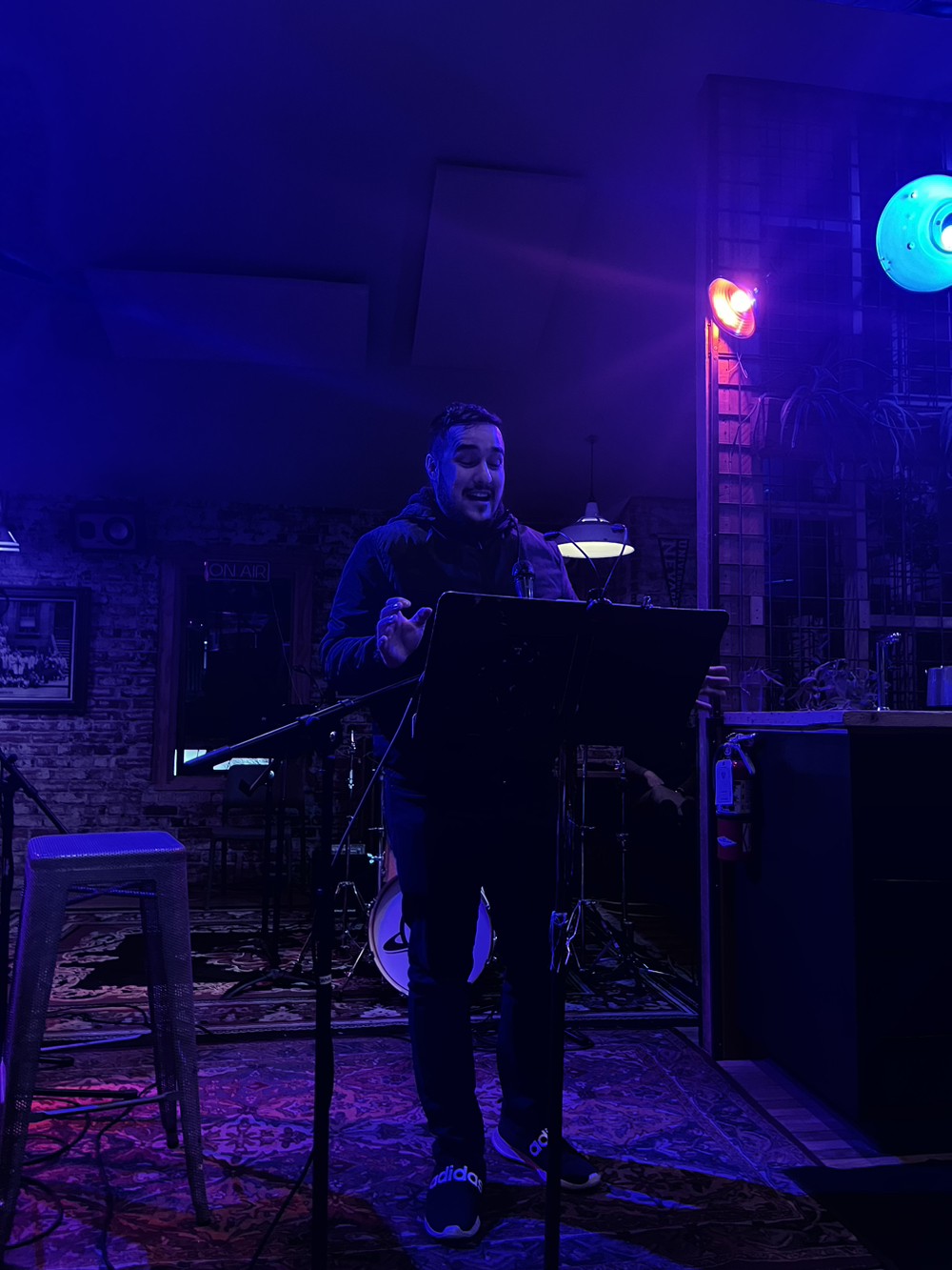 Image of Jamie onstage at poetry night