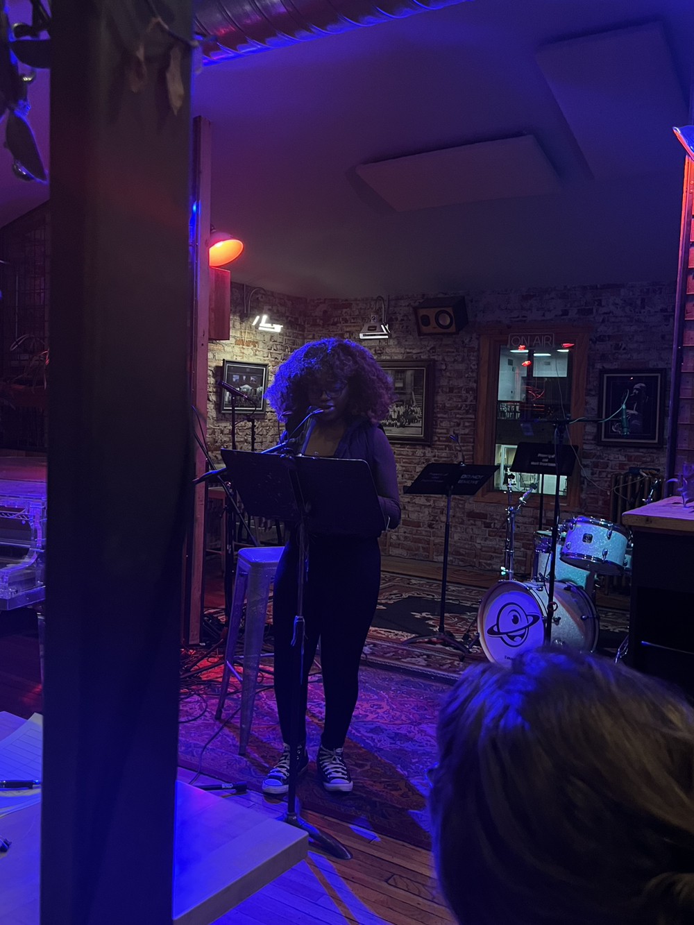 Image of Sylvia onstage at poetry night