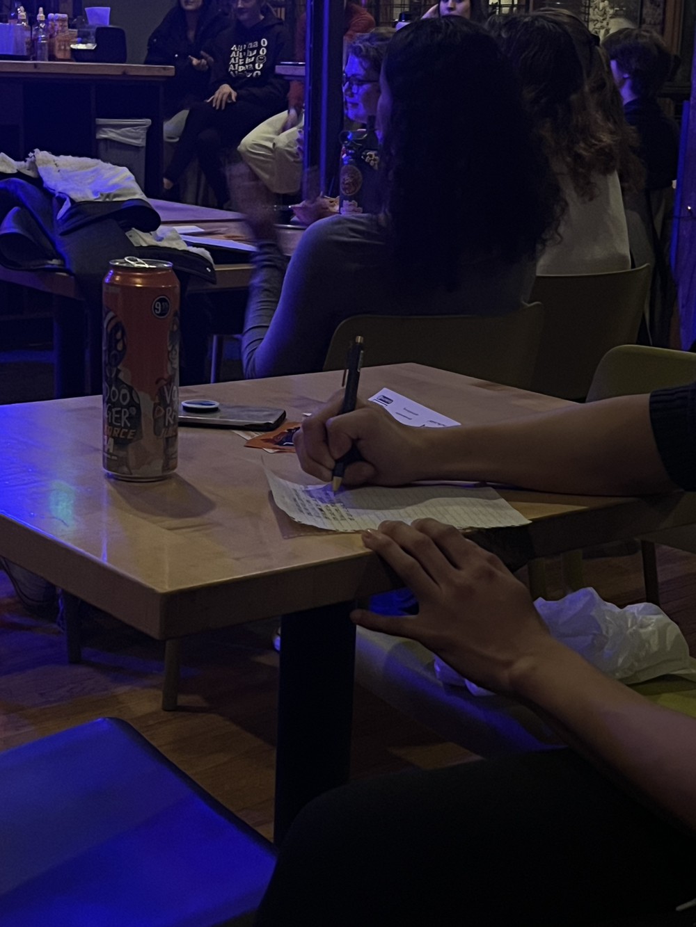 Image of poem being written at poetry night